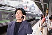 man using phone in tokyo