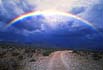 rainbow over dirt road